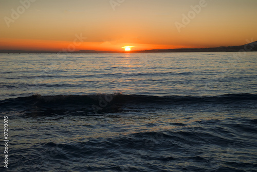 Sunset over beach at Marbella on Costa del Sol Spain