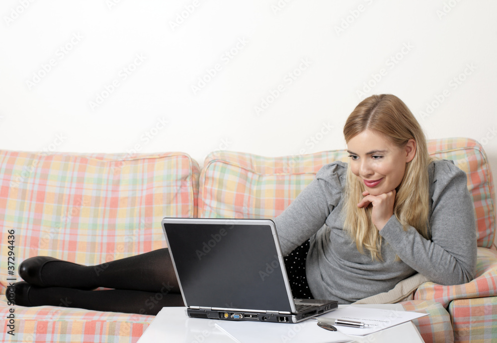 A young business woman is still working at home A young business woman is still working at home