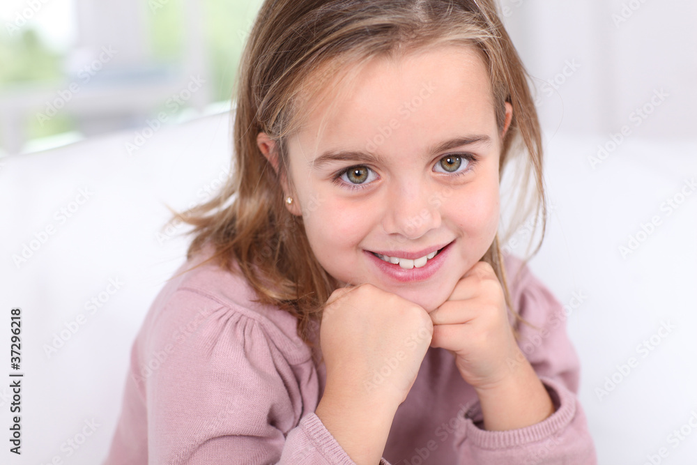 Portrait of cute little girl with hands on chin Portrait of cute little girl with hands on chin