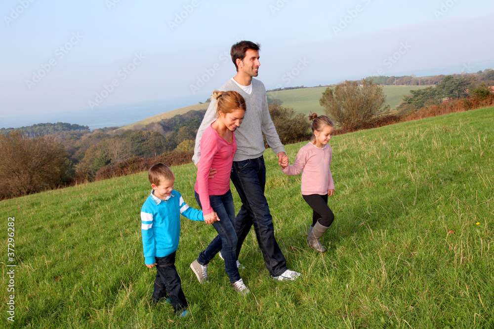 Family having a walk in countryside Family having a walk in countryside
