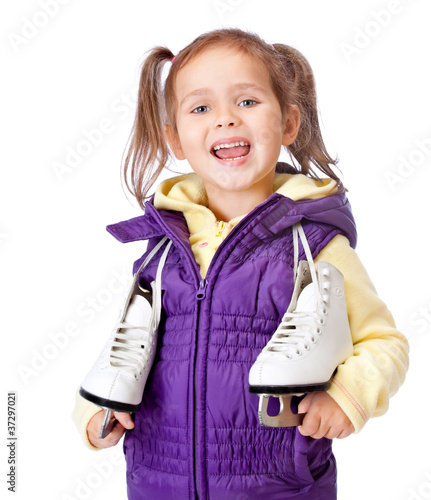 little girl holds skates on white background
