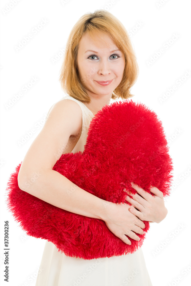 A woman holds a heart in his hands on a white background. A woman holds a heart in his hands on a white background.