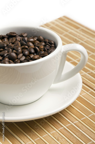 Coffee beans in the white cup