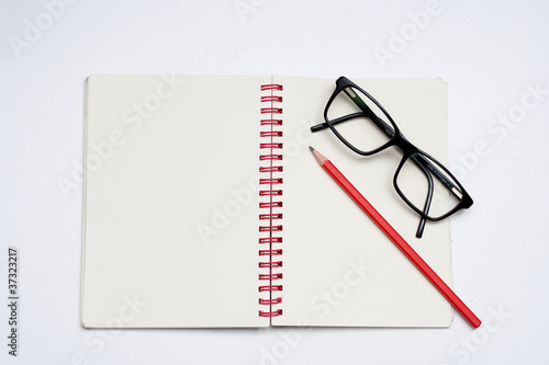 notebook red pencil black glass