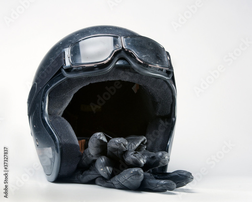 Old motorcycle helmet, gloves and gloves.