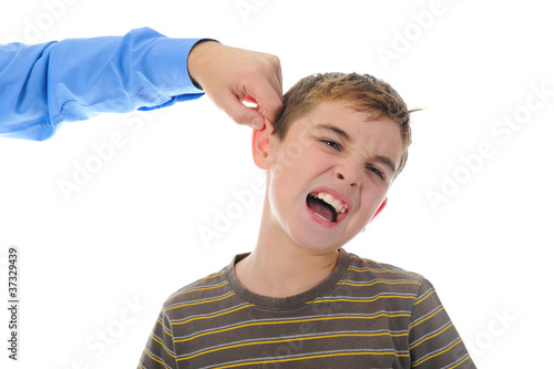 Strict father punishes his son photo