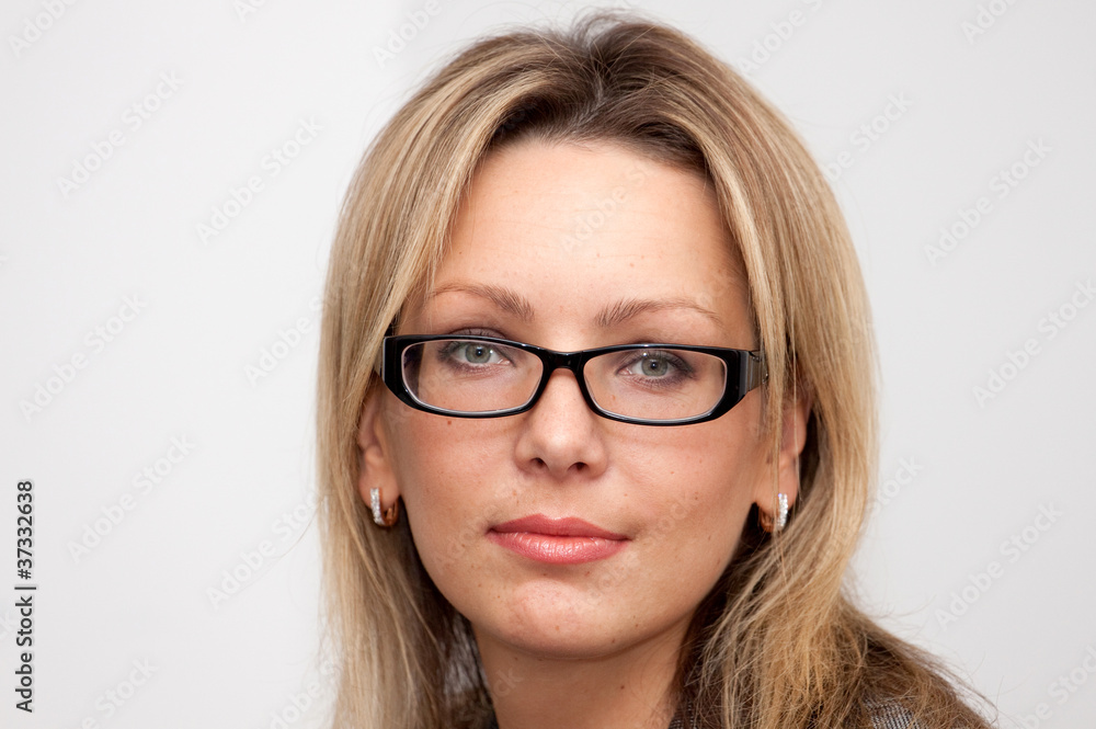 Portrait of blonde woman in glasses with long hair