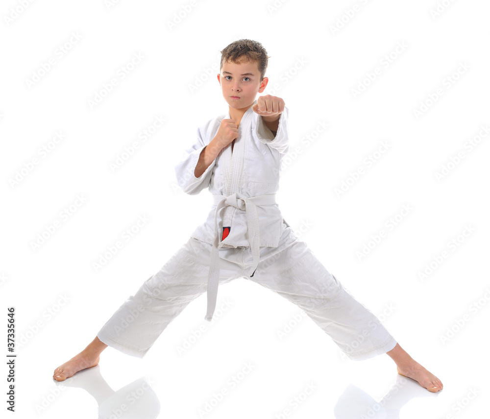 Young boy training karate. Young boy training karate.