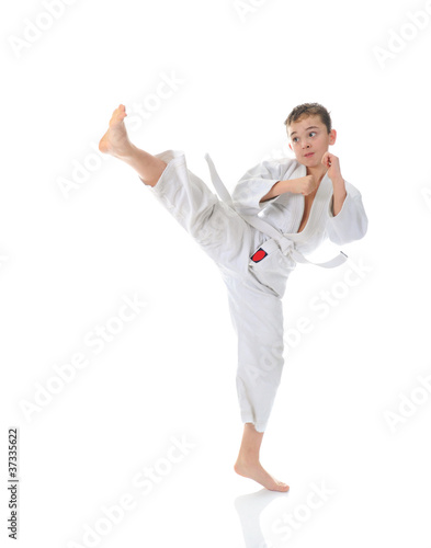 Young boy training karate.