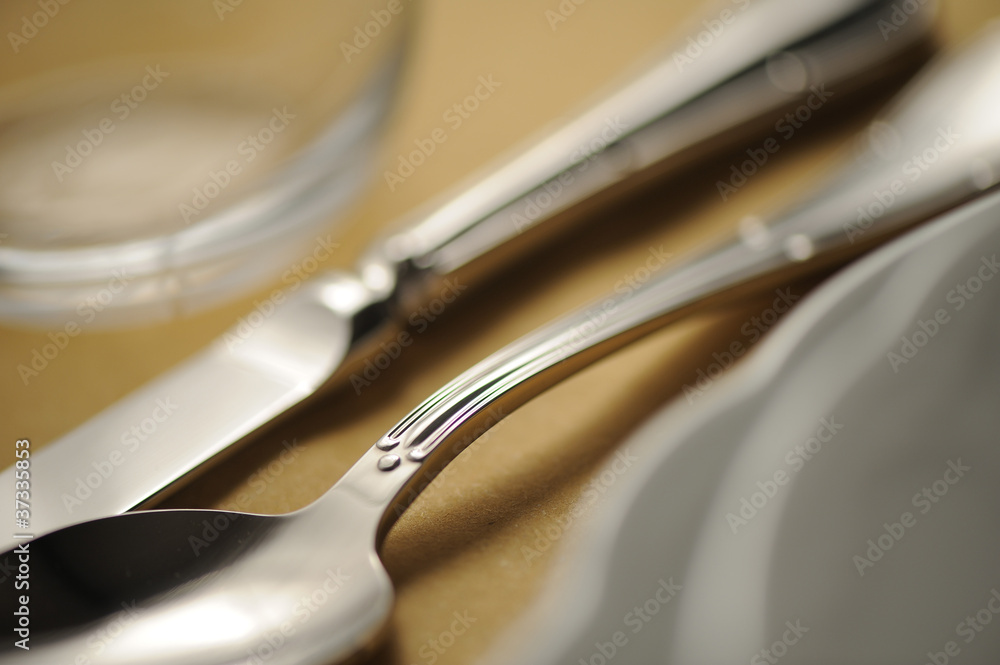 Close-up of silverware , on the dining table. Close-up of silverware , on the dining table.