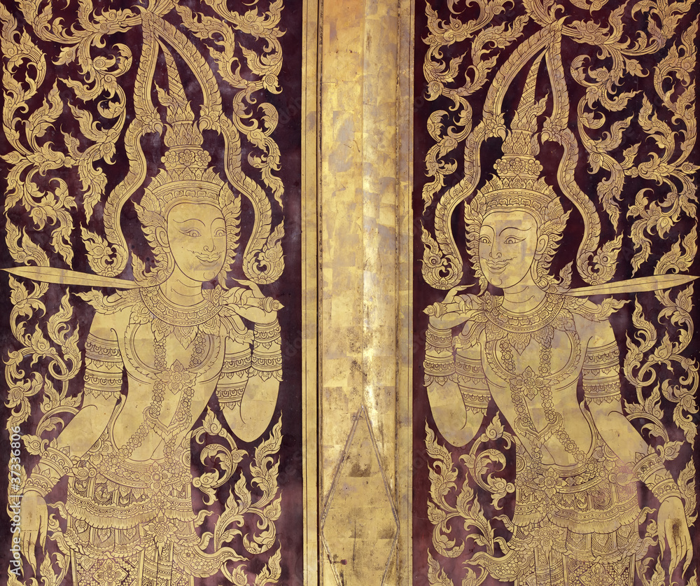 Ancien golden angel picture on the door in Thai temple.