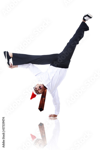 Asian businessman with christmas hat doing handstand