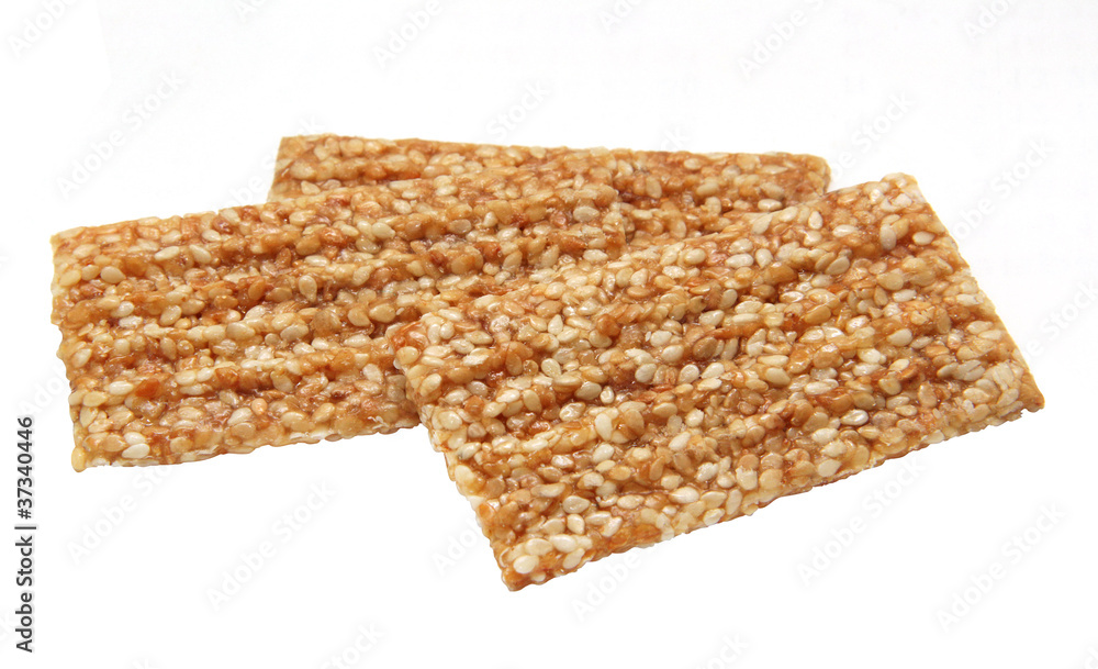 Kozinaki of sesame on a white background Kozinaki of sesame on a white background
