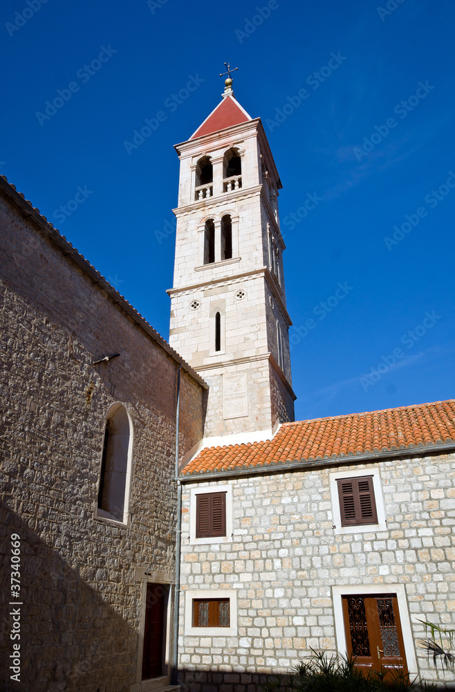 Old church belltower in ancient village of Croatia.
