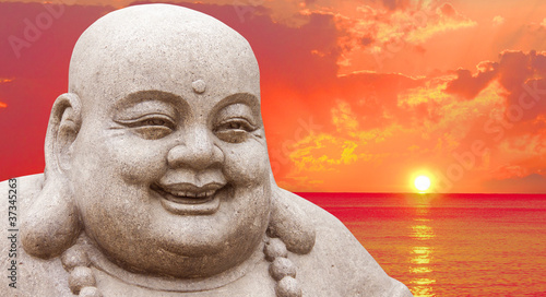 Leinwand Poster Buddha and a sunset