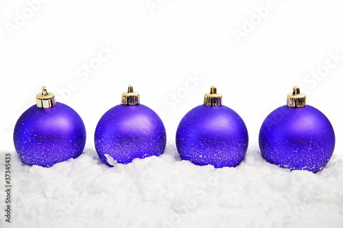 christmas ornaments in snow