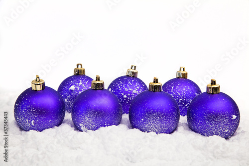 christmas ornaments in snow