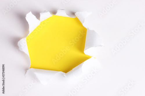 Torn paper with yellow background