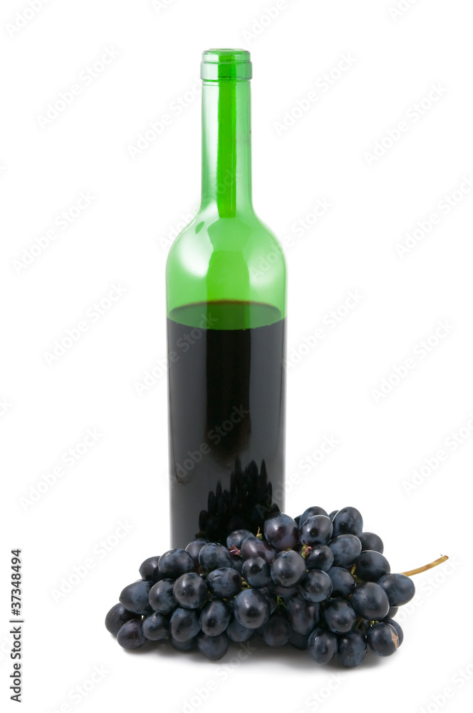 Bottle with wine and a cluster of grapes