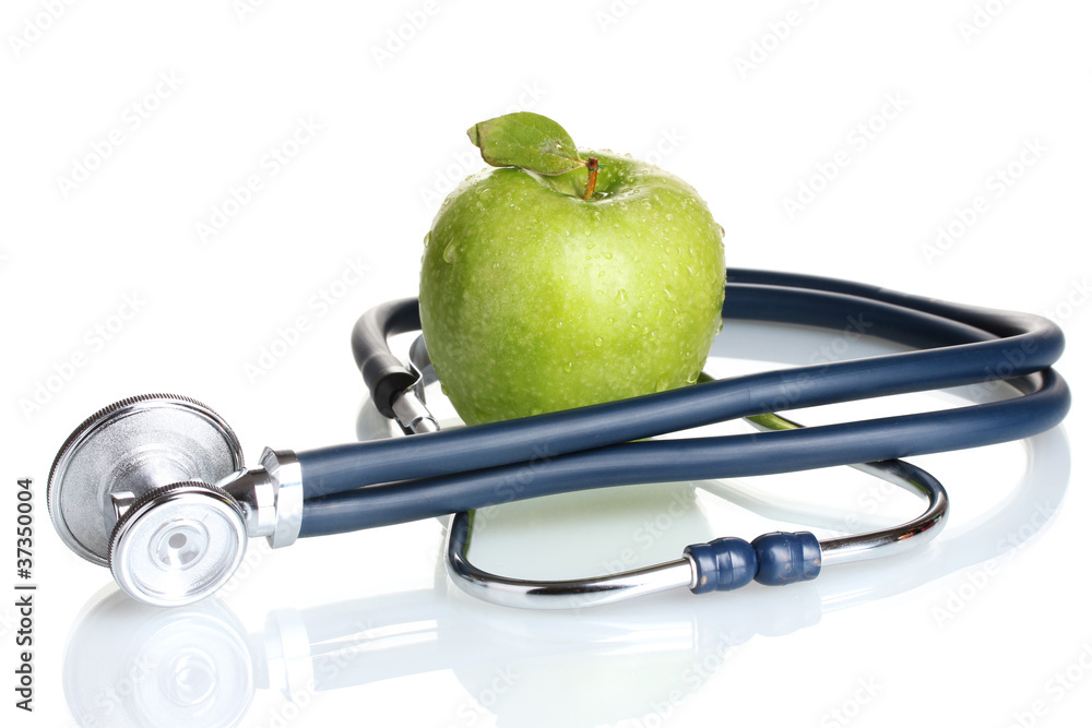 Medical stethoscope and green apple isolated on white Medical stethoscope and green apple isolated on white
