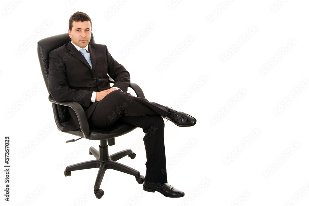 Portrait of a thoughtful young businessman sitting on office cha Portrait of a thoughtful young businessman sitting on office cha