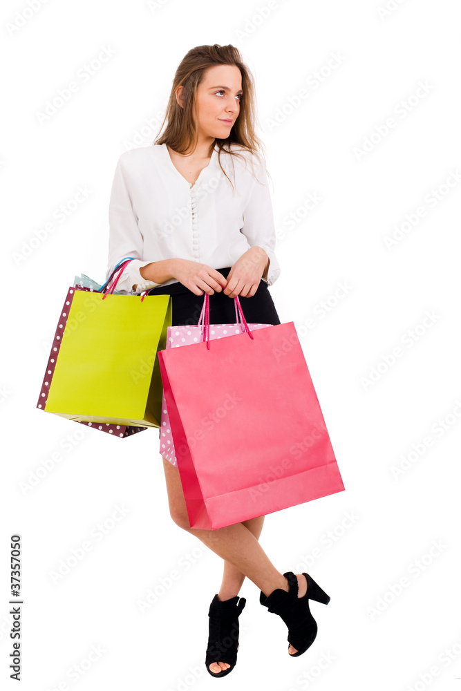 Elegant young woman with shopping bags over white background Elegant young woman with shopping bags over white background