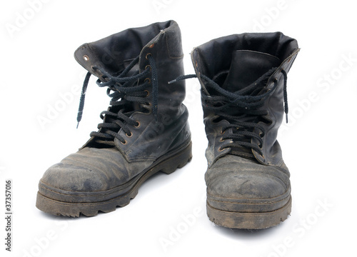 Old army boots on a white background