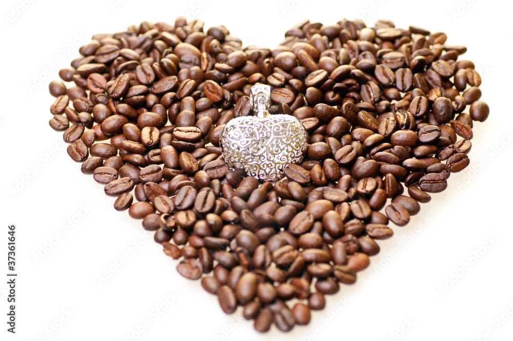 Heart shape coffee beans with a silver pendant Heart shape coffee beans with a silver pendant