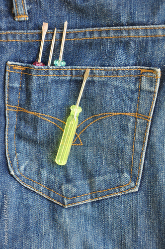 Blue jeans pocket with tools screwdriver photo