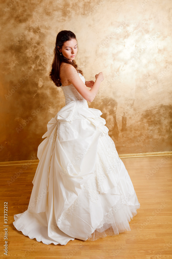 Beautiful dark haired woman in white bridal dress Beautiful dark haired woman in white bridal dress