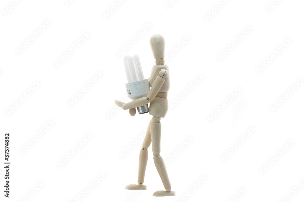 Wooden Manikin Doll Holding Low Energy Bulb Wooden Manikin Doll Holding Low Energy Bulb