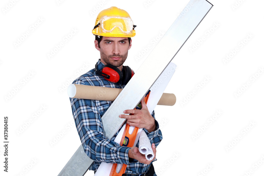 A handyman with his arms full. A handyman with his arms full.