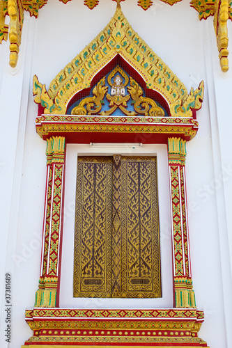 Vintage traditional Thai style art painting on temple's window