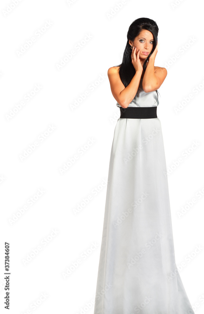 beautiful girl wearing long silver dress looks enigmatic