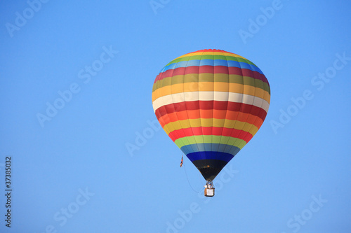 colorful hot air balloon on  blue sky © beachboyx10