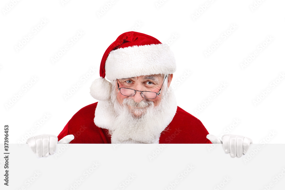 Naklejka premium Santa holding white blank banner