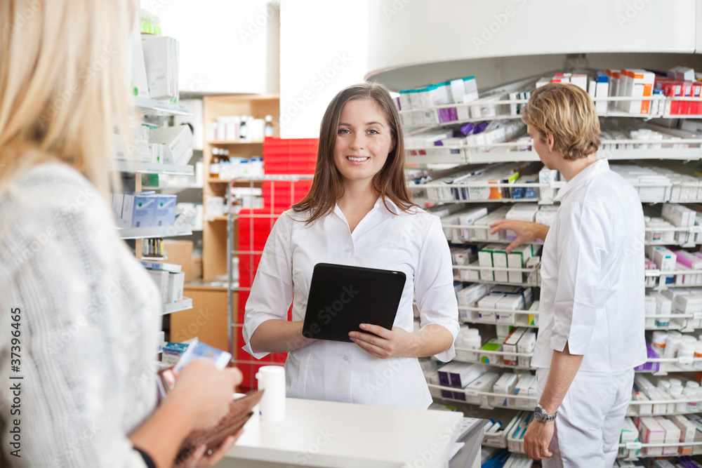 Female Pharmacist Holding Tablet PC
