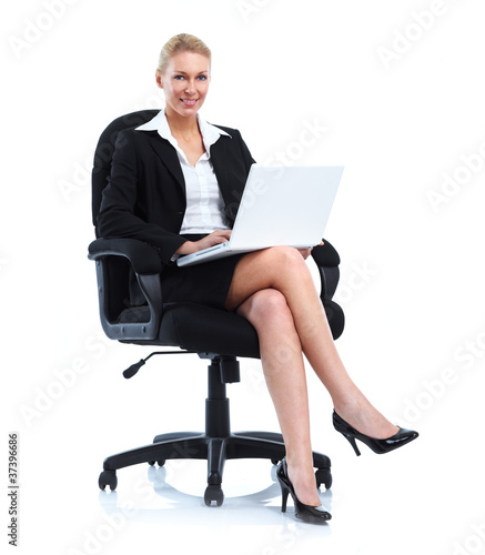 Smiling business woman with laptop.
