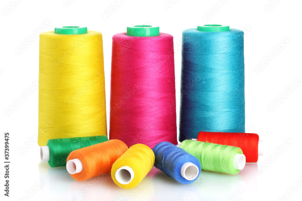 Many-coloured bobbins of thread isolated on white Many-coloured bobbins of thread isolated on white
