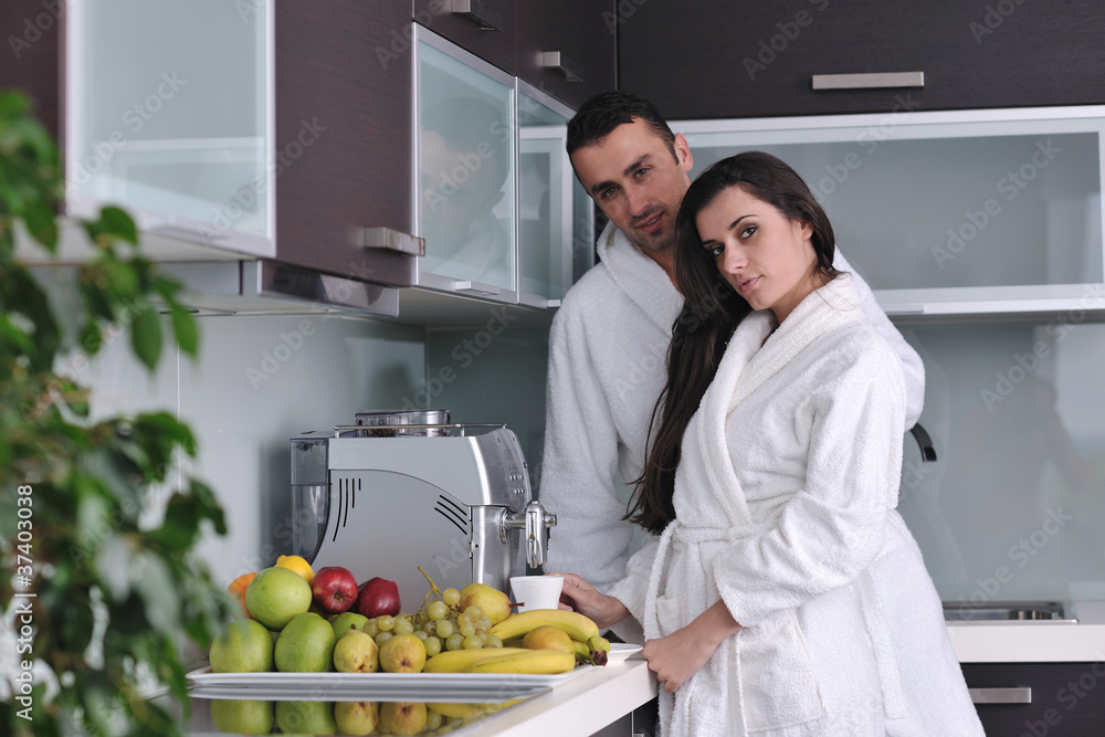 Fototapeta premium young couple have fun in modern kitchen