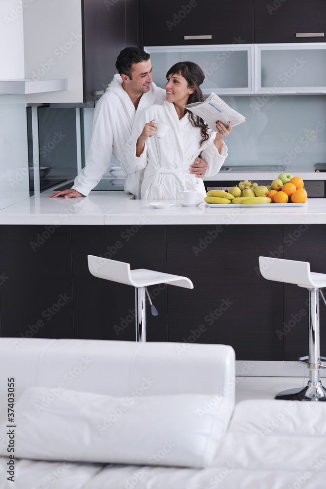 Fototapeta premium young couple have fun in modern kitchen