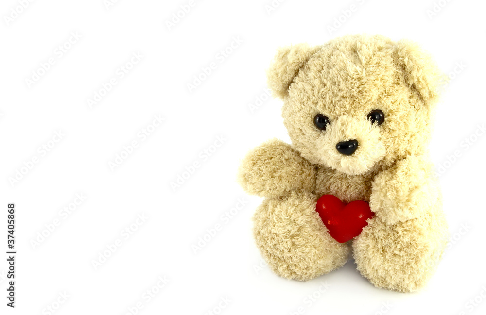 Obraz premium teddy bear toy with heart on white background