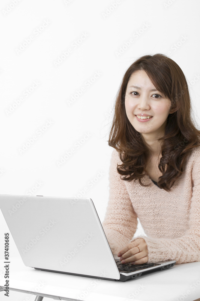 Beautiful asian woman using a laptop computer Beautiful asian woman using a laptop computer