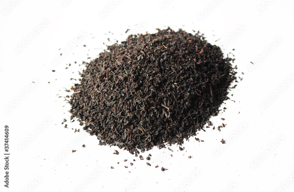 Handful of black tea leaves on white background Handful of black tea leaves on white background