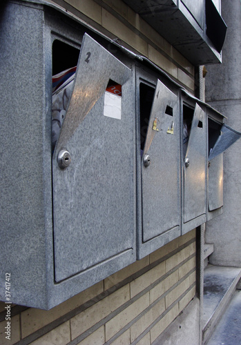 vandalized mail boxes in a row