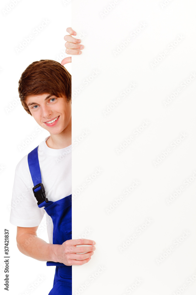 junger bauarbeiter mit hinweisschild junger bauarbeiter mit hinweisschild