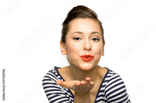 Young woman blowing a kiss