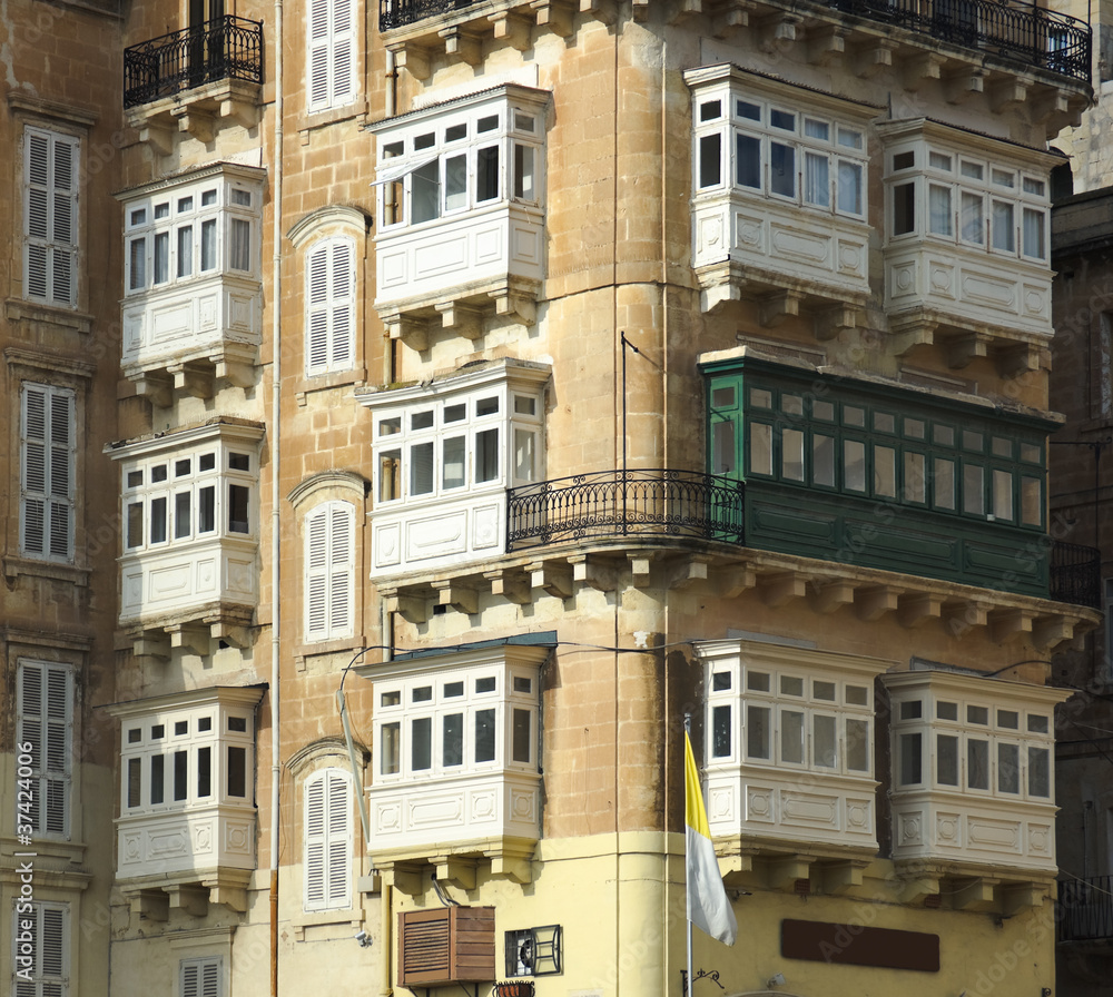 Baroque Facades And Traditional Balconies In Valletta Street
