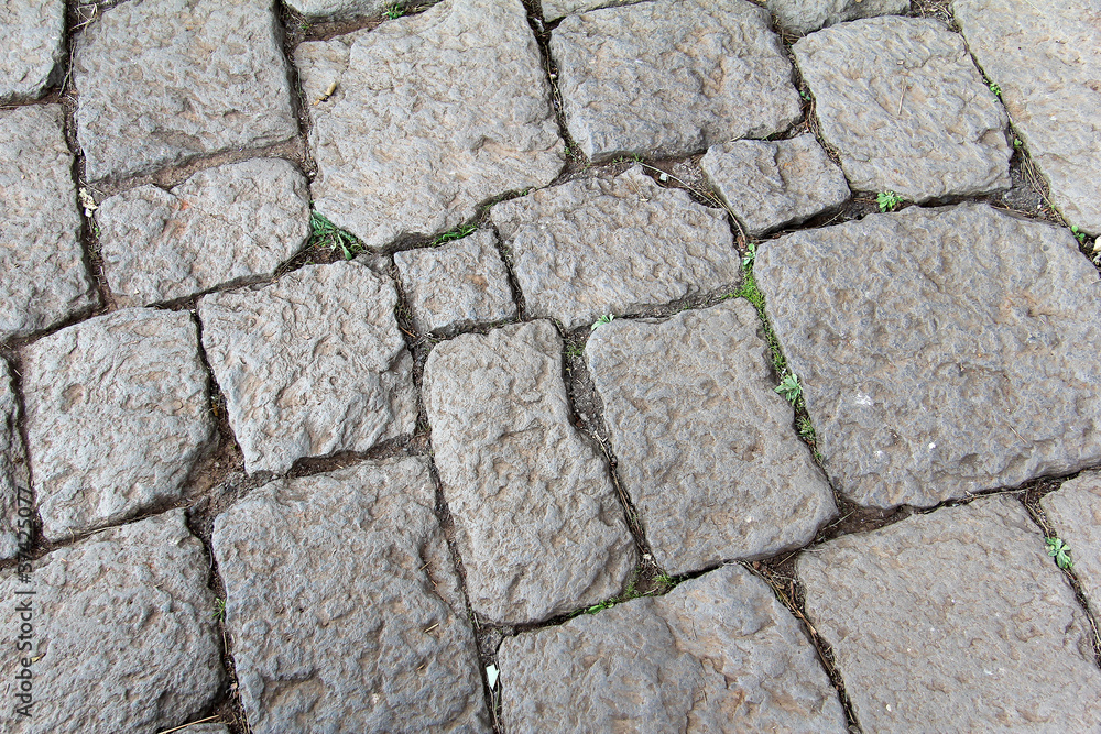 A pattern created by a floor made of stones A pattern created by a floor made of stones