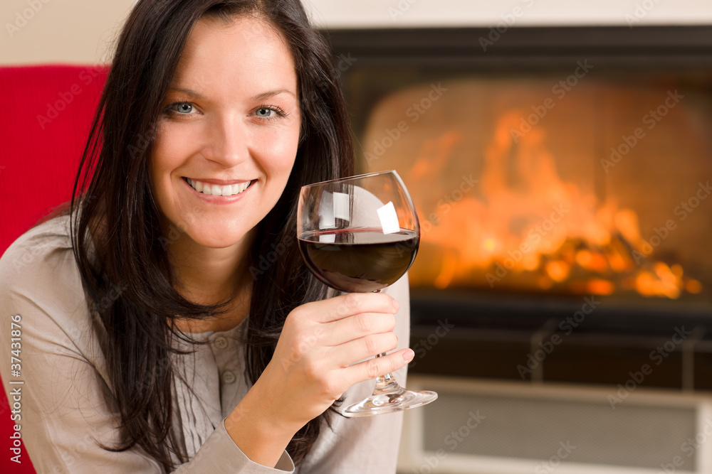 Winter home fireplace woman glass red wine Winter home fireplace woman glass red wine